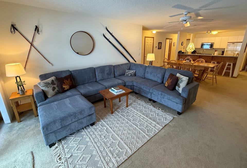 Main living area with gas fireplace, TV and games