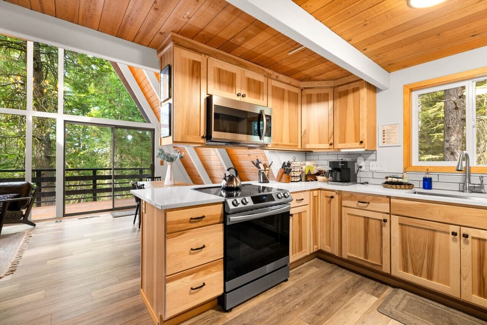 Oven, range and microwave in chef's kitchen with an Apple HomePod to play your favorite tunes