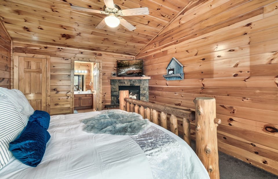 Watch one more episode from your king bed while the corner fireplace flickers, then wash up in the ensuite right through the door.