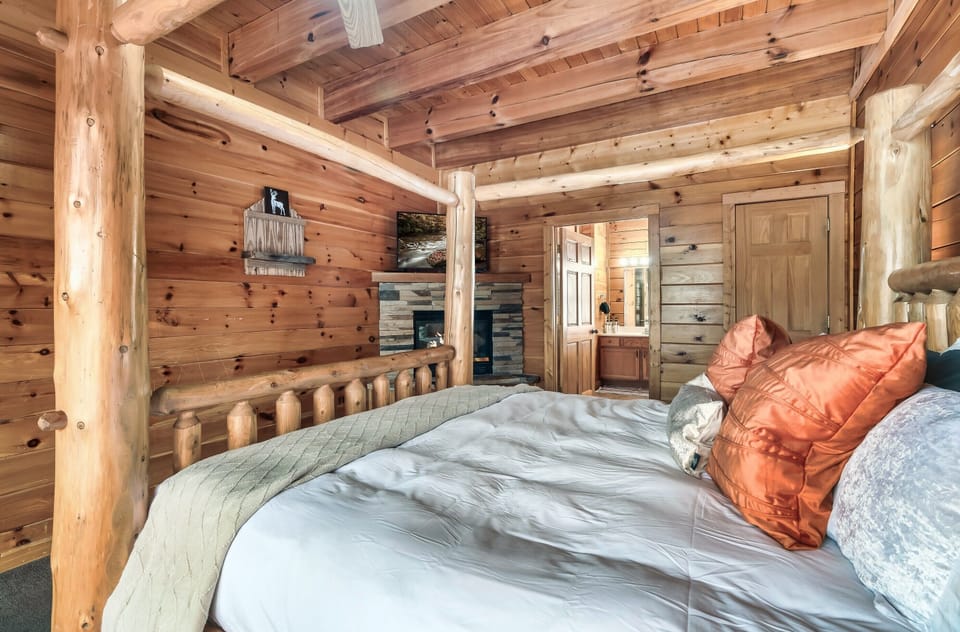 Unwind in your main level king suite, corner fireplace glowing and the ensuite a few steps from the bed.