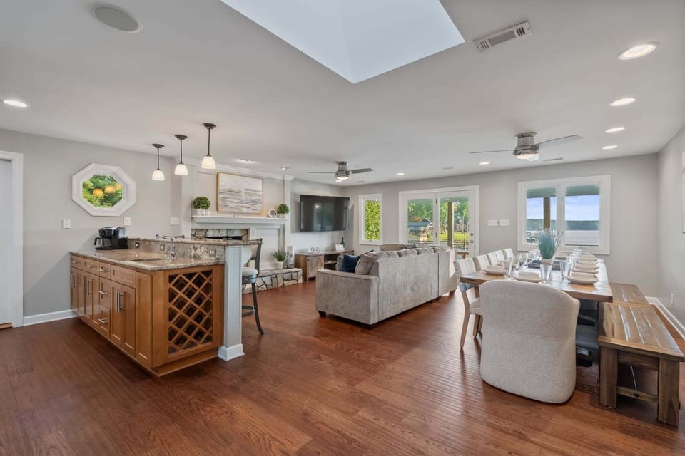 Open concept main floor with living, kitchen & dining altogether. Dining table seats 10.
