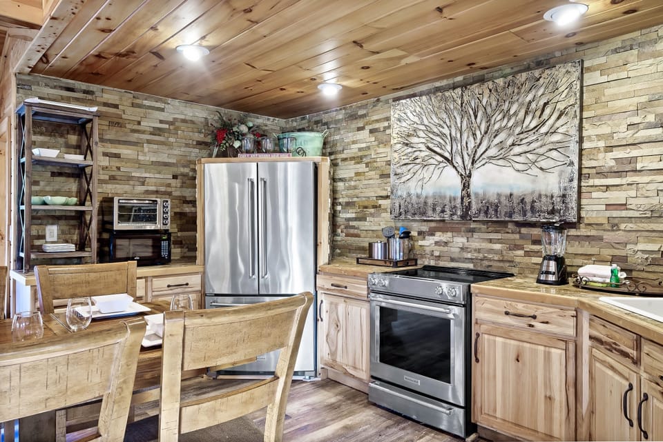 Kitchen with stainless refrigerator. Ice maker in the lower freezer tray.