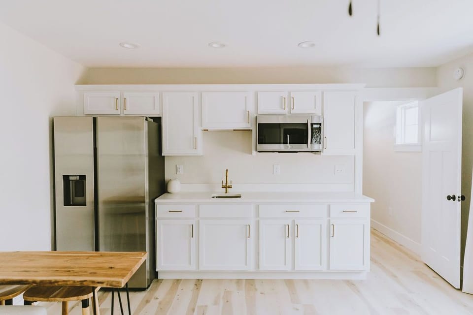 Private lower-level kitchenette with full-size fridge, microwave & sink.