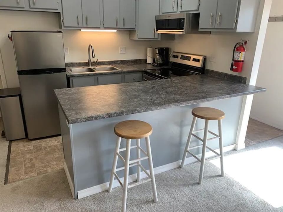 Full kitchen with large fridge/freezer, stove and oven, toaster, coffee maker. 