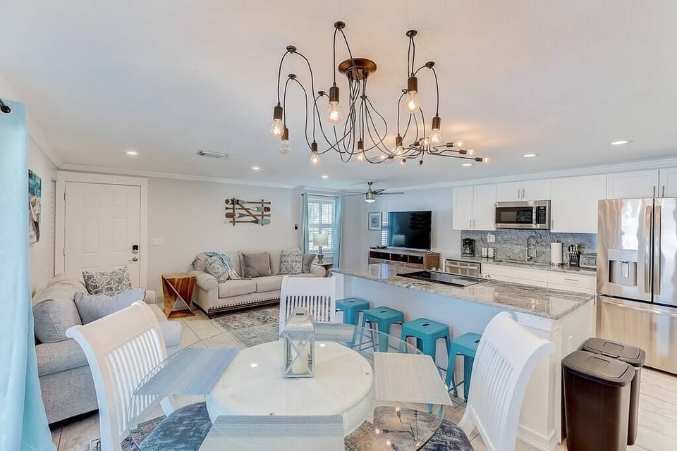 Open living room, dining area, and kitchen
