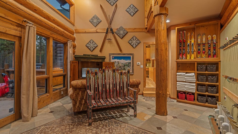 Mudroom on main level with access leading to ski run