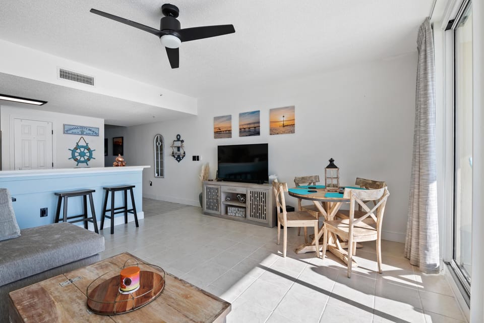 Guests can enjoy the open concept floorplan. The living room offers a comfortable sectional with incredible gulf views, as well as a large television.