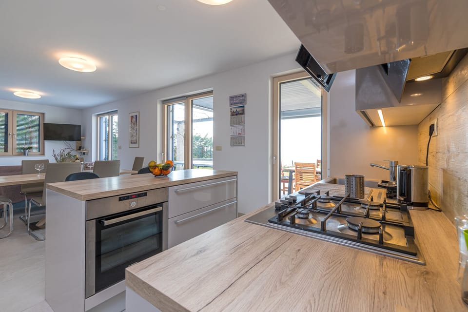 Kitchen with gas stove and kitchen island