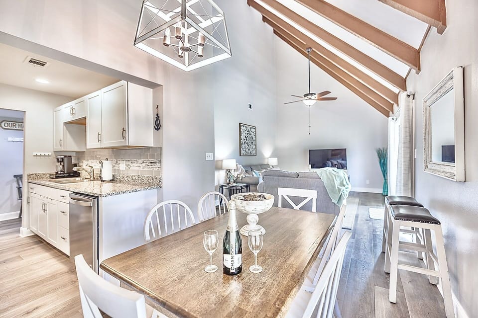 The vaulted ceilings with natural wood beams allow for an inviting spacious feel with an abundance of natural lighting.