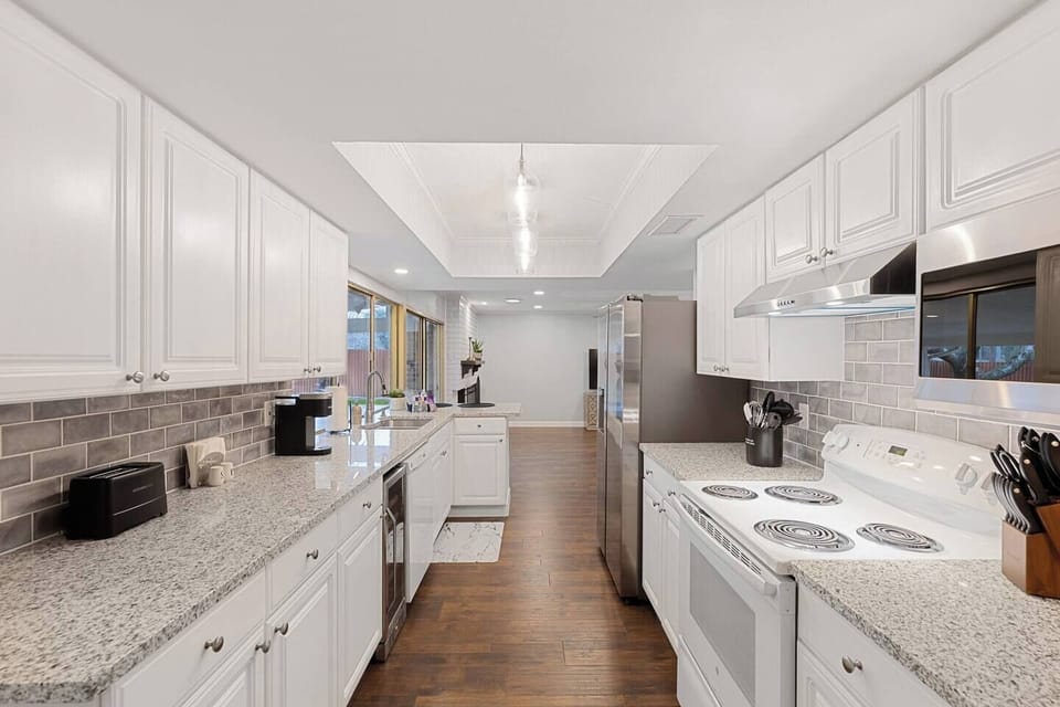 Kitchen: Bright and inviting space with sleek countertops and modern appliances awaits your culinary adventures!