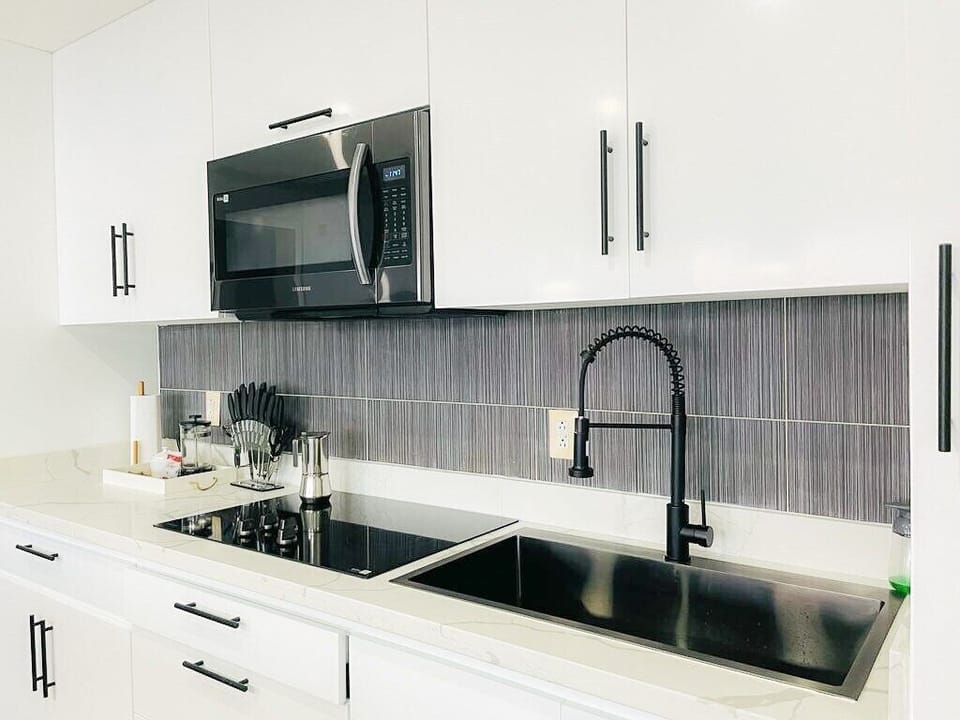 Experience the convenience and style of our brand new modern kitchen. Fully equipped with state-of-the-art appliances and beautiful finishes, this kitchen is the perfect place to cook up a storm or simply enjoy a cup of coffee with a view.