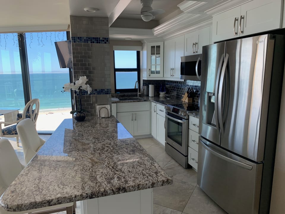 Open Kitchen / LR / Dining to capture stunning 270 degree views!