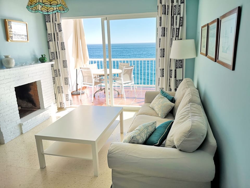 Salon with fire place amazing sea views