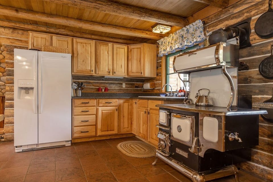 Kitchen includes extensive spice collection and basic condiments. Wood burning cookstove is great for cooking and heating the cabin on cold days. 