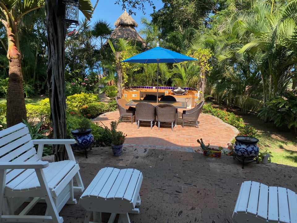 patio and barbeque area next to casa