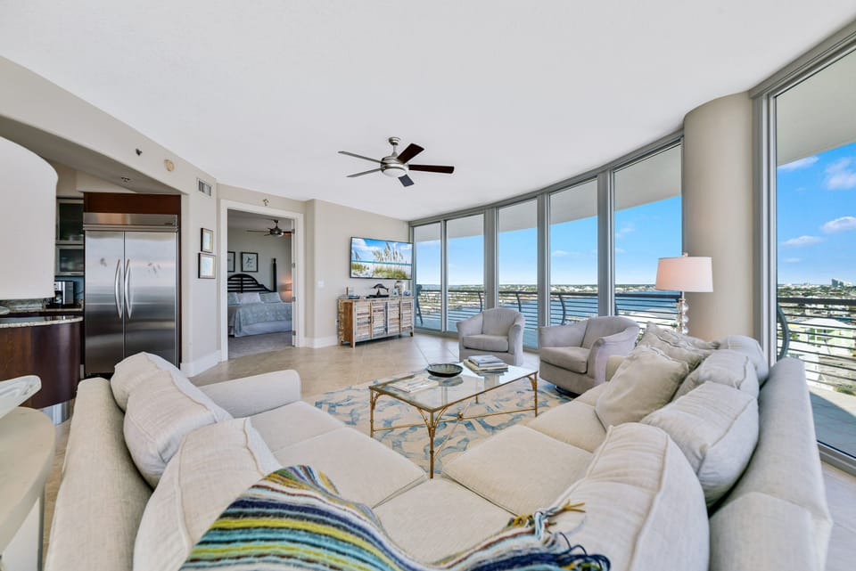 A light-filled living space with captivating views. This inviting room offers a perfect blend of comfort and style, creating a welcoming atmosphere for all.