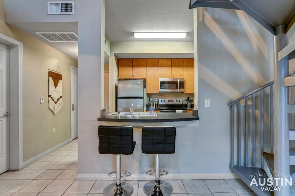 Fully equipped kitchen with all the essentials and bar seating