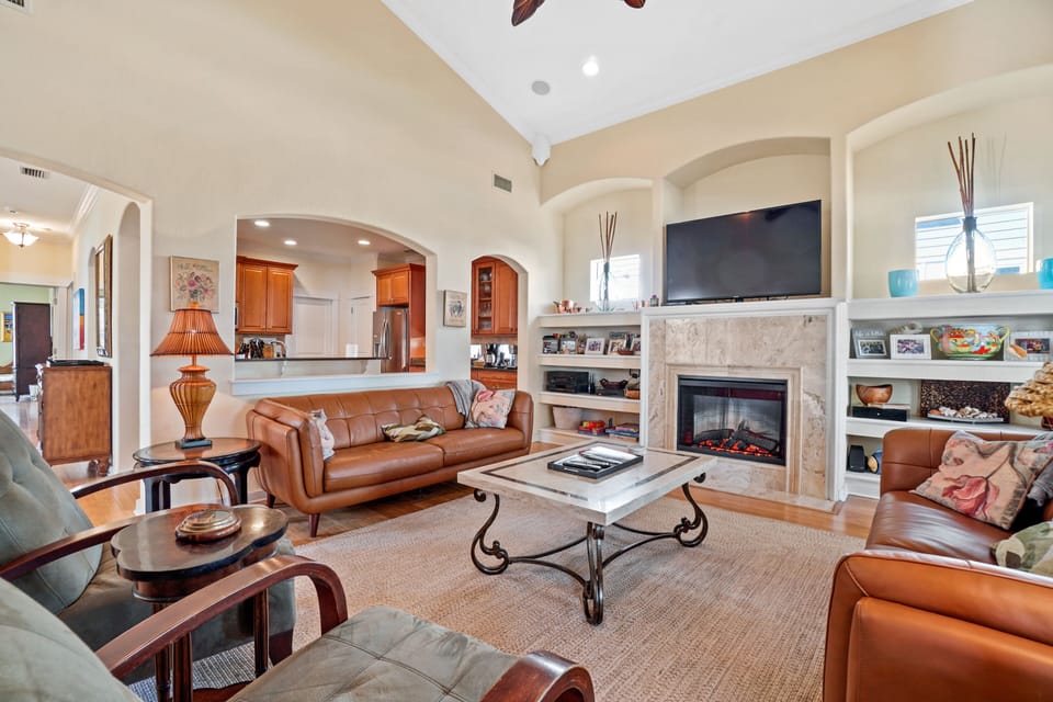 Den stocked with games, TV and 'fireplace". 