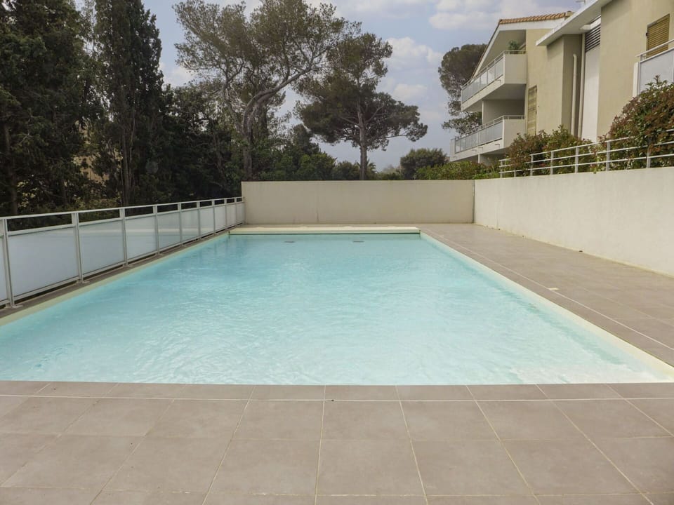 Water, Sky, Swimming Pool, Azure, Shade, Cloud, Rectangle, Building, Tree, Grass