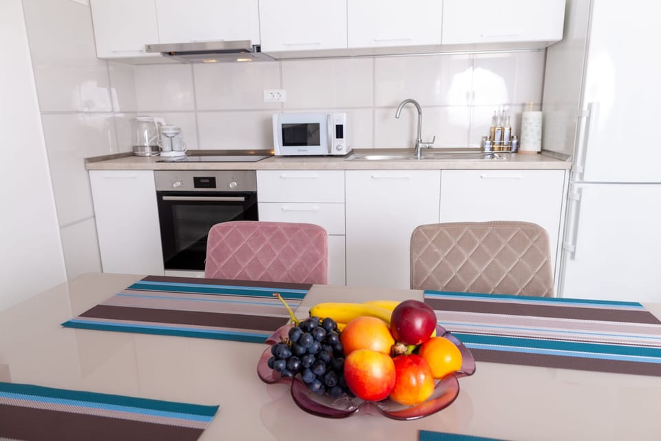 Dining table and kitchen.