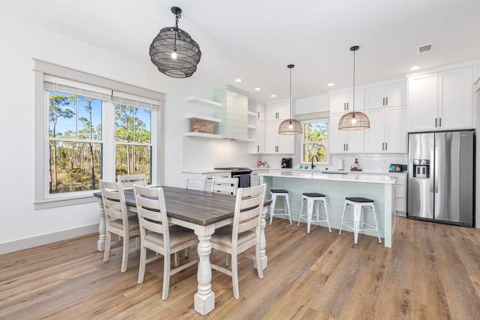 Dining table with seating for 6-8. Additional seating at large island.