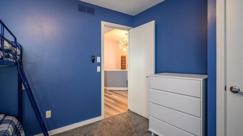 Upper level guest room has closet and dresser offering plenty of clothing storage. Unpack and make yourself at home!