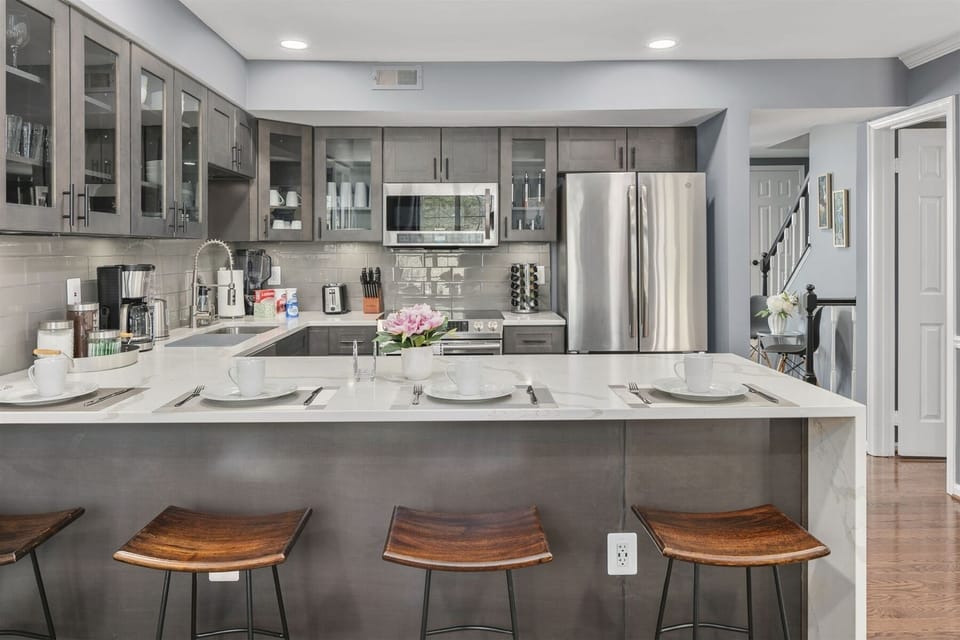 Waterfall peninsula extends four counter stools