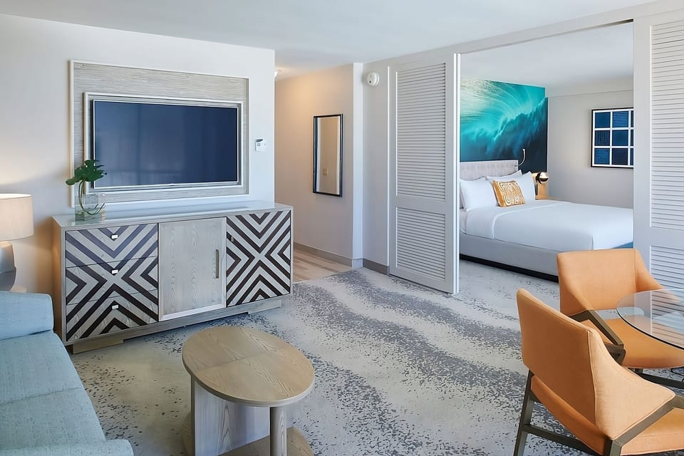 Unwind on the sofa with big-screen entertainment after beach days.