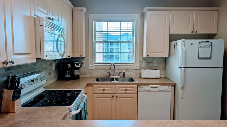Kitchen provides  all you would need to stay in and cook a meal.