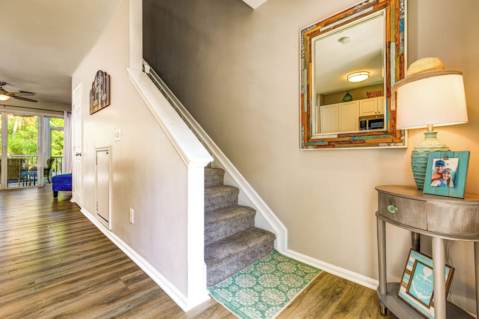 Stairs lead to 2 bed/2bath upstairs. Half bath is located under the stairs.