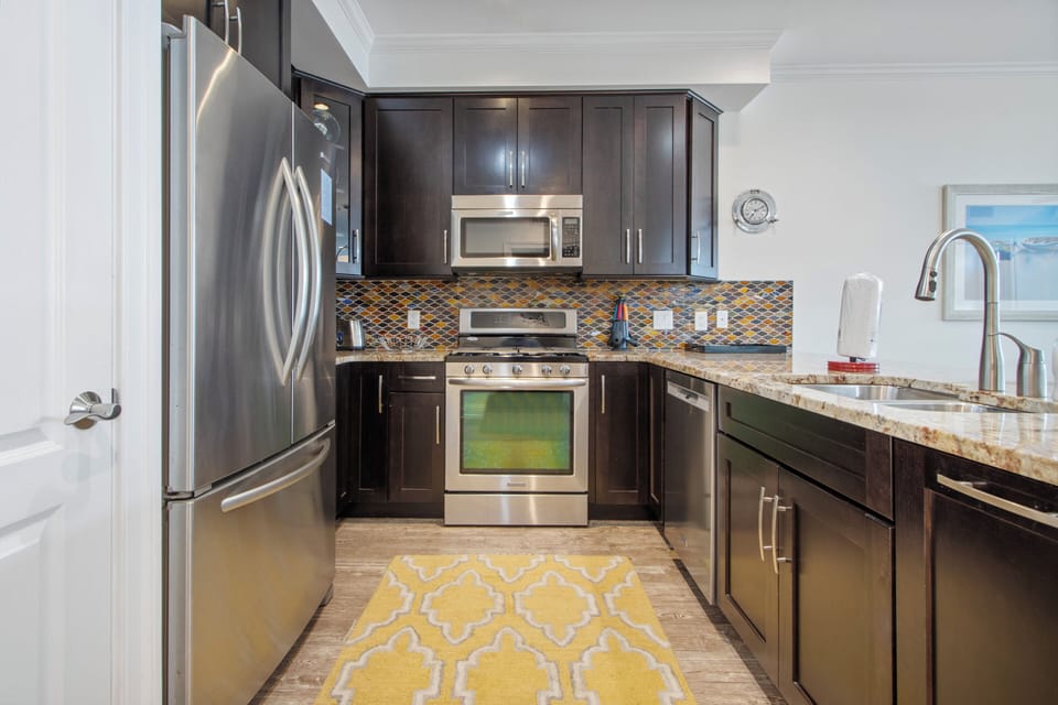 Well stocked kitchen with stainless steel appliances