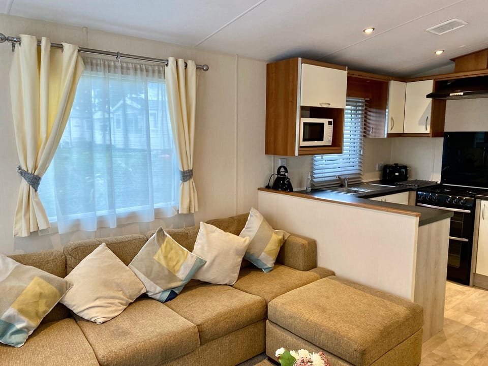 Cosy sofa with kitchen behind