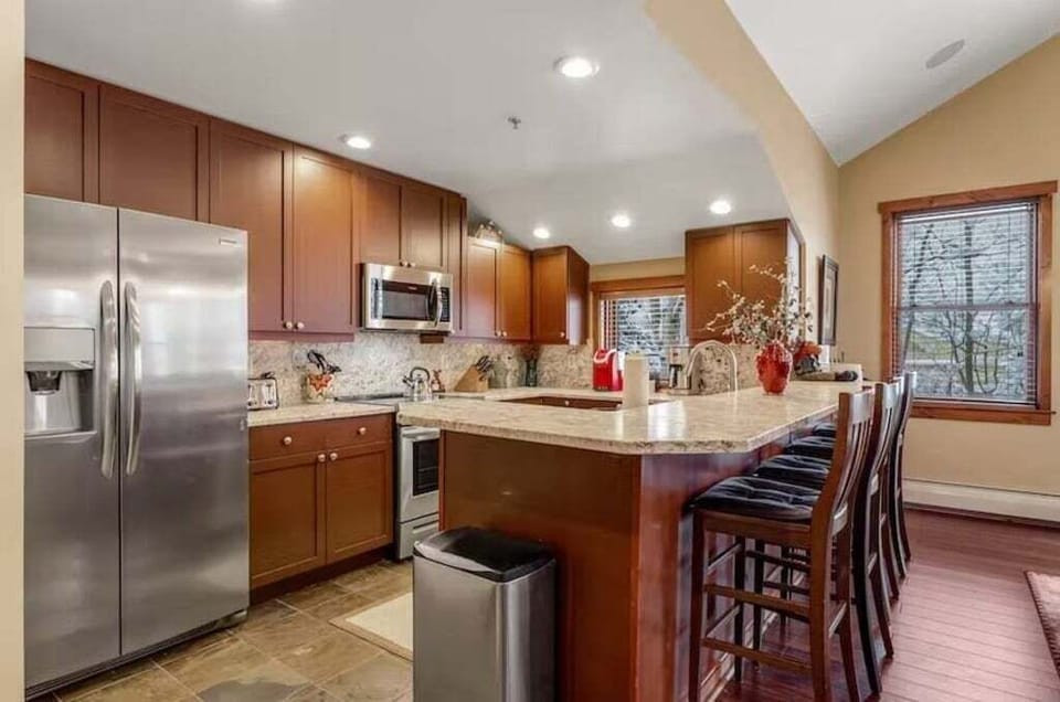 Kitchen with granite countertops and breakfast bar