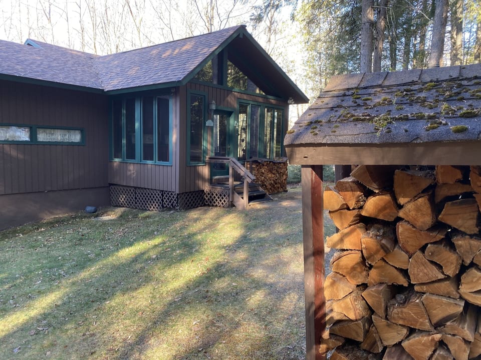 Wake up to sun peeking through tall trees...there's three acres of them!
