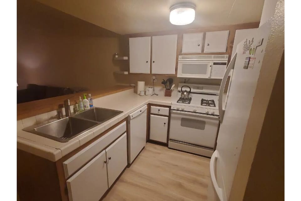 full kitchen w cookware, dishes, coffee maker