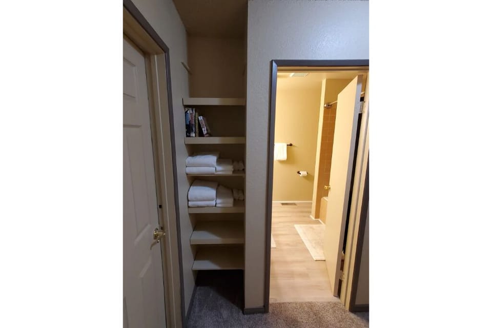 hallway w storage, W/D, bath and bedroom access