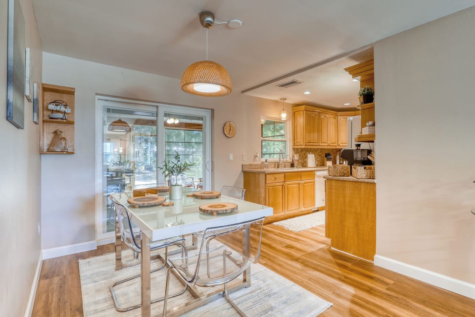 Stylish table for six in a warm, luxurious dining setting.