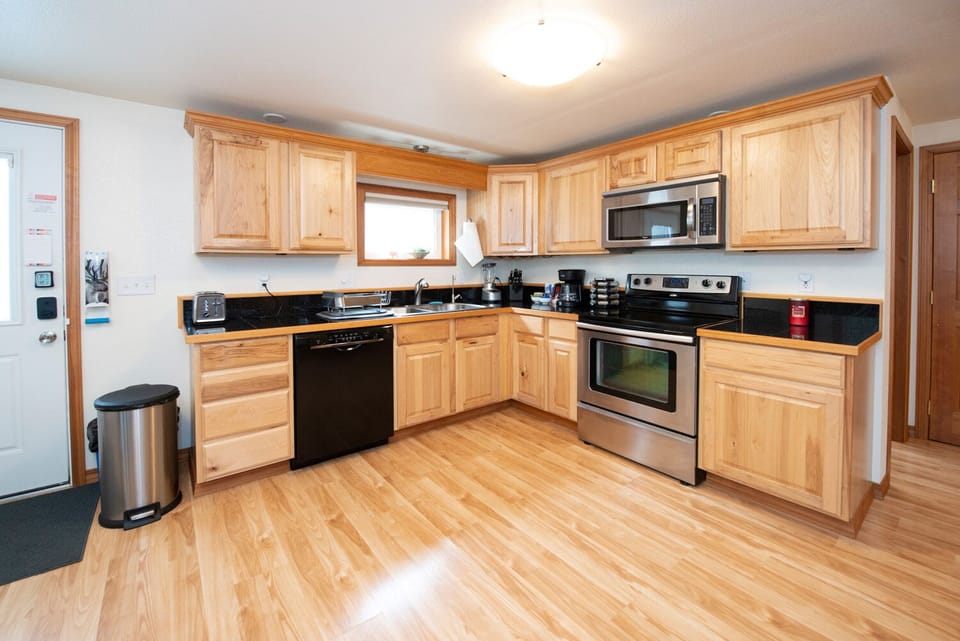 Open concept, modern with all the appliances, gadgets, & utensils you may need.