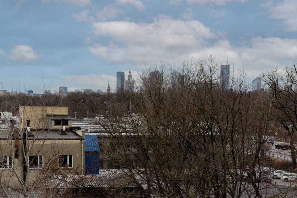 Views of the immediate neighbourhood and the distant city skyline with skyscrapers,