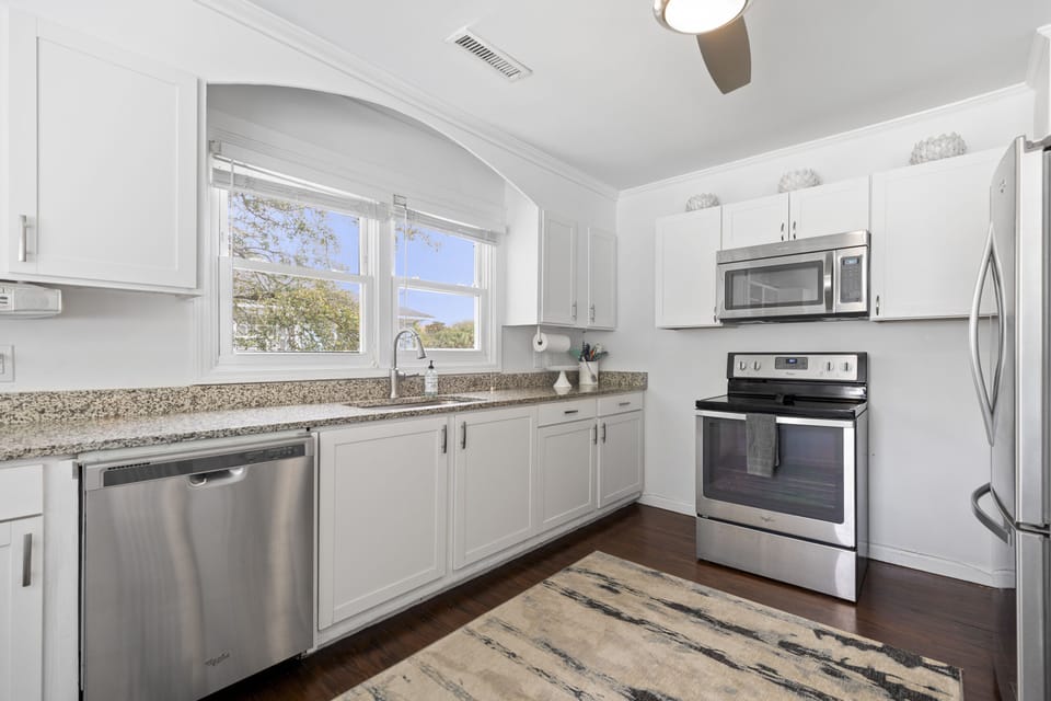 Bright Kitchen with ample counter space and fully equipped kitchen — steps from the beach