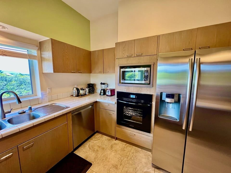 OTHER SIDE OF KITCHEN WITH A-BAY VIEW