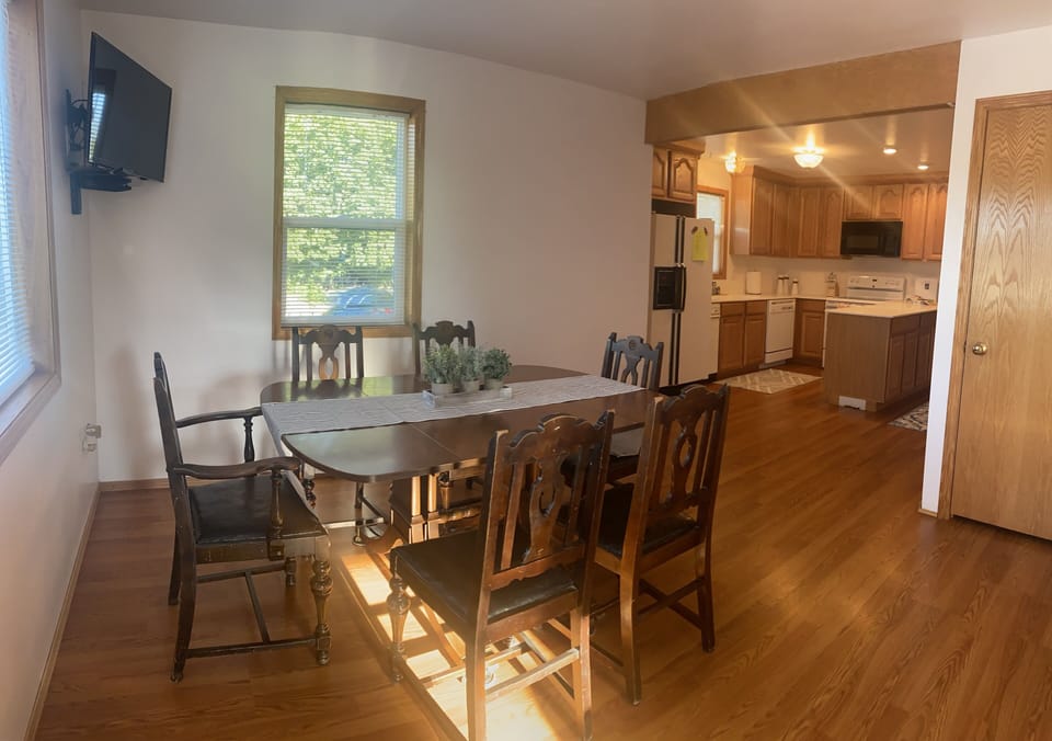 Kitchen table leaf extends to seat eight (8)