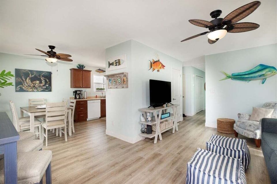 Our space harmoniously blends the living room, dining area, and kitchen.