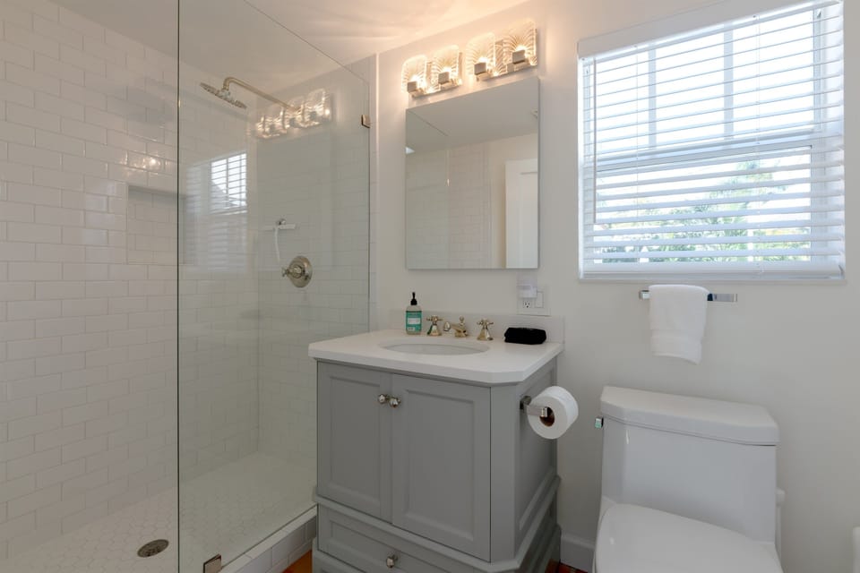 The Master en-suite Bathroom has been newly renovated bathroom with step in large shower.