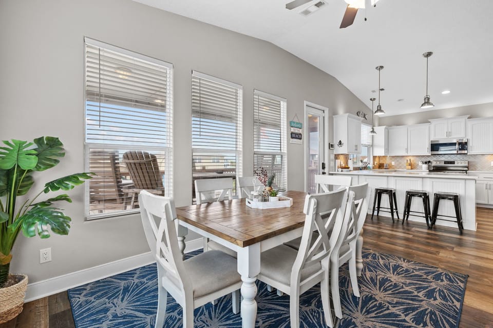 Seating for six at the dining table plus four bar stools.