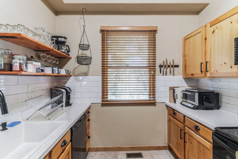Well-stocked with pots, pans, spices, condiments, crock-pot and more!