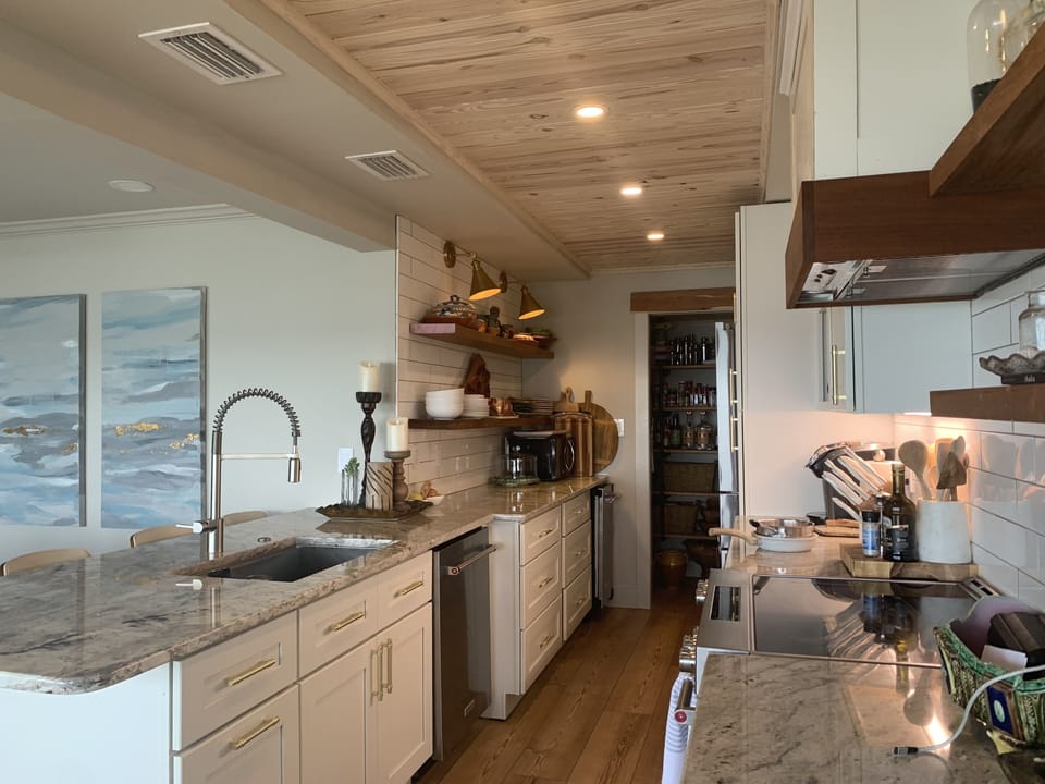 New Galley kitchen with updated appliances and eating bar