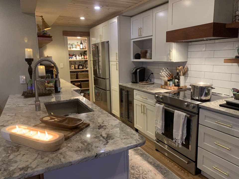 Bosch fridge, wine fridge, stove with additional warming/baking drawer 