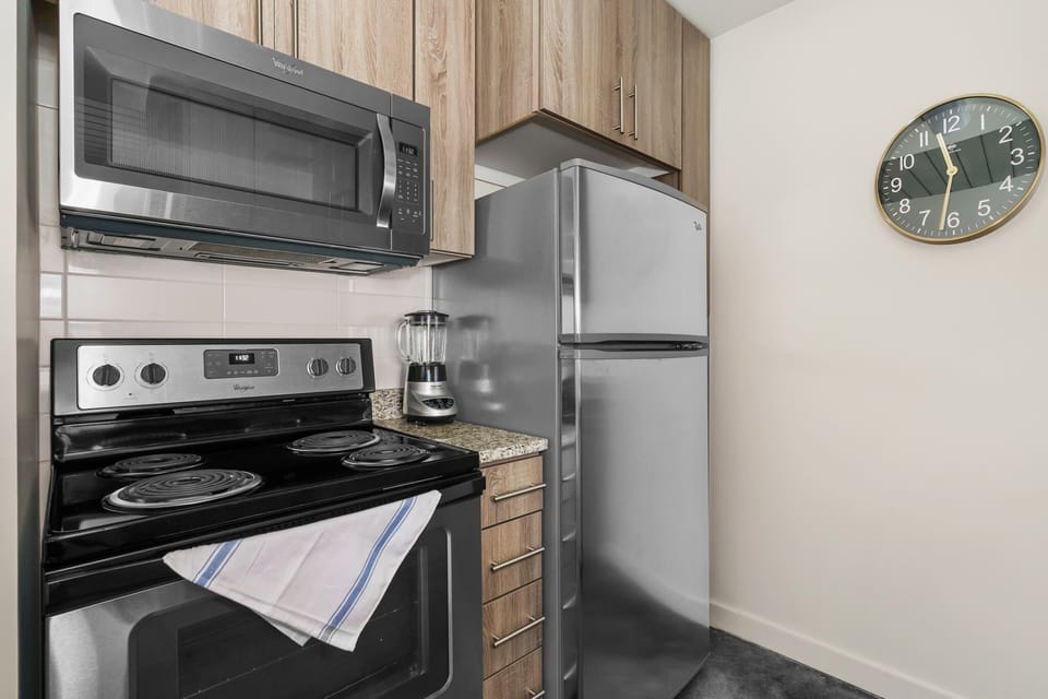 Prepare your favorite dishes in this well-equipped kitchen with modern amenities.