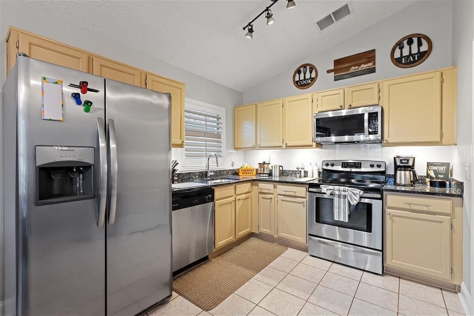 Our kitchen with granite tops and stainless steel appliances 